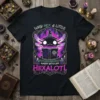 Black t-shirt with "Why Hex a Little When You Can Hexalotl" text and a witchy axolotl reading a book with