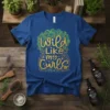 Blue t-shirt with "Wild Like my Curls" in glittery gold and green calligraphy, surrounded by decorative swirls and stars