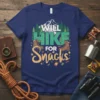 Will Hike For Snacks t-shirt with hiking boots, mountains, and pine trees graphic