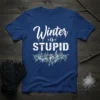 White text "Winter is STUPID" with ice crystal graphic on a blue t-shirt