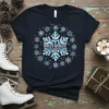 Dark navy t-shirt featuring a large snowflake graphic with "WINTER WONDER LAND ADVENTURES" text inside, surrounded by smaller snowflakes