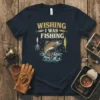 Wishing I Was Fishing t-shirt design featuring a jumping trout and fishing lures in vintage style