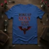 Woke Up Sexy as Hell Again text with gothic bat graphic on a blue t-shirt