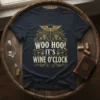 Woo Hoo! It's Wine O'Clock quote on a dark navy t-shirt with golden ornate design and wine glass graphics