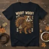 Bulldog dressed as a turkey with "WOOF! WOOF!" text and bones graphic on a navy t-shirt