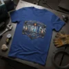 World's Largest Natural Gas Supply text design on a blue t-shirt with industrial pipe graphics and flames
