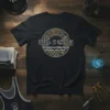 Black t-shirt with "Wrestling The Element of Folding Clothes with People Still in Them" quote surrounded by gears and chain