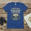 Yakkin' Is My Therapy t-shirt design featuring a kayaker in a scenic mountain river landscape, surrounded by trees and waves
