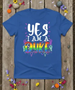 YES I AM A DYKE t-shirt design with rainbow lettering and raised fist graphics