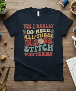 Yes I Really Do Need All These Cross Stitch Patterns quote on a navy t-shirt, with retro fonts and sewing