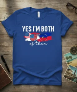 YES I'M BOTH of them text with sunglasses featuring American and Haitian flags on a royal blue t-shirt