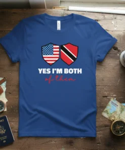 Blue t-shirt featuring shields with the USA and Trinidad flags and the text "YES I'M BOTH of them"