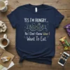 Yes I'm Hungry... No I Don't Know What I Want To Eat quote on a navy t-shirt with spoon and