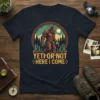 Yeti or Not Here I Come Bigfoot T-Shirt with a vintage forest scene and cryptid graphic