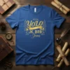 Blue t-shirt with gold text "YOLO JK, BRB - Jesus" featuring wings and a halo