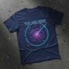 Navy blue t-shirt with "YOU ARE HERE" text above a neon pink and blue swirling galaxy graphic with constellations and