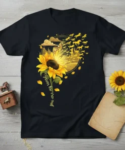 Sunflower t-shirt design with the text "you are my sunshine" in cursive, featuring a golden circular graphic with horses and