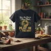 Black t-shirt with "You Are Never Too Old PLAY IN THE DIRT" quote and gardening graphics