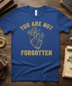 You Are Not Forgotten t-shirt with anatomical heart and flowers graphic, in yellow distressed font