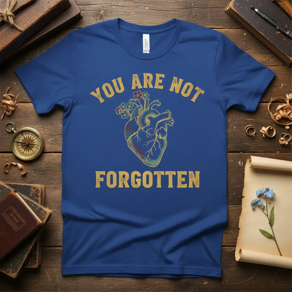 You Are Not Forgotten distressed quote on a royal blue t-shirt with anatomical heart and floral graphic