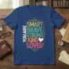 You Are Smart Brave Strong Kind Loved positive affirmation text design on a navy blue t-shirt
