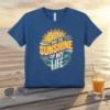 You Are The Sunshine Of My Life quote with a smiling sun graphic on a blue t-shirt, beach theme