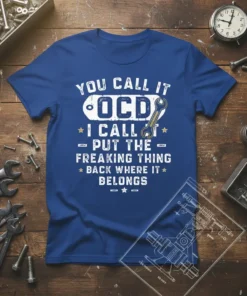 Blue t-shirt with white text quote: "YOU CALL IT OCD I CALL IT PUT THE FREAKING THING BACK WHERE IT