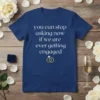 Navy t-shirt with white text "you can stop asking now if we are ever getting engaged" and engagement rings graphic