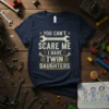 You Can't Scare Me I Have Twin Daughters quote on a navy t-shirt with wrench and dragonfly graphics