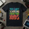 You Can't Scare Me I Have Two Kids humorous quote on a black t-shirt, featuring colorful distressed typography