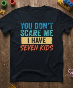 You Don't Scare Me I Have Seven Kids quote on a black t-shirt, featuring distressed blue, teal, and orange lettering