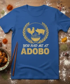 You Had Me At Adobo T-Shirt with rooster and pig graphics above a bowl of food