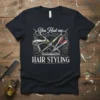 Black t-shirt with "You Had me at HAIR STYLING" text and graphics of scissors, comb, hair dryer, and razors