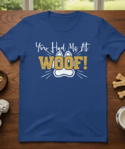 You Had Me At WOOF! t-shirt with paw print graphic, white and gold text on blue shirt