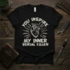 Black t-shirt with white text "You Inspire My Inner Serial Killer" and a graphic of a human heart surrounded by