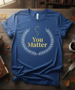 Blue t-shirt with gold "You Matter" text inside a white laurel wreath and a small constellation graphic
