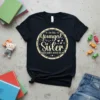 Text "I'm The Youngest Sister Rules Don't Apply To Me" in a circle on a black t-shirt, with decorative stars