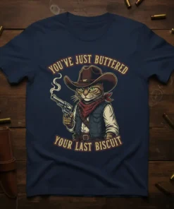 Cowboy cat wearing a hat and bandana, holding a smoking gun, with text "YOU'VE JUST BUTTERED YOUR LAST BISCUIT" on