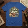 Zoo Crew t-shirt design featuring cartoon giraffes, lions, elephants, zebras, tigers, and parrots surrounded by leaves