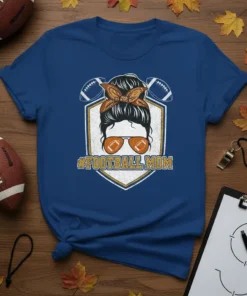 #FOOTBALL MOM graphic t-shirt featuring a messy bun, sunglasses, and footballs, perfect for sports moms