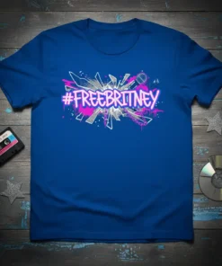 #FREEBRITNEY hashtag text with microphone and abstract graphic elements in pink and silver on a blue t-shirt