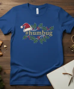 Royal blue t-shirt with a vintage-style design featuring a Santa hat and holly sprigs around the text "#humbug"