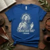 "I NEVER SAID THAT" - Jesus quote on a blue t-shirt with an illustration of Jesus in a halo
