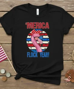 'Merica Flock Yeah! text with a patriotic flamingo wearing sunglasses and a bandana on a black t-shirt