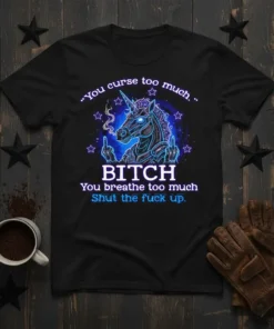 Graphic t-shirt featuring a neon-style unicorn giving the middle finger with the quote "You curse too much. BITCH You breathe